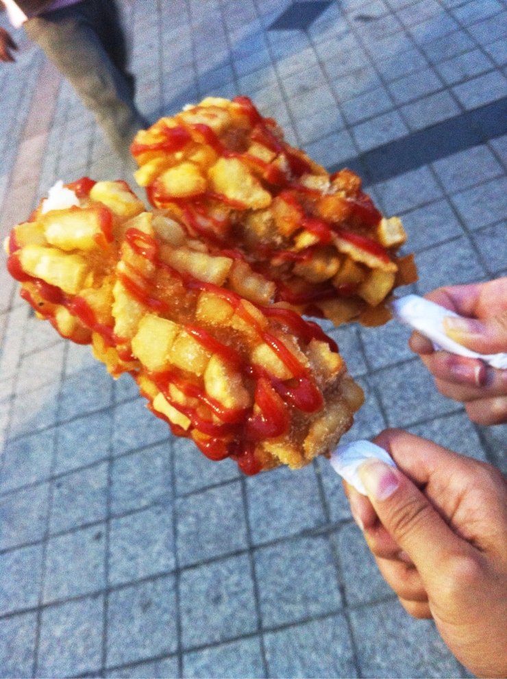 Gamja hot dogs — Korean potato corn dogs with ketchup from a street stall