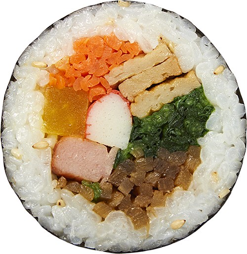 Cross-section of Korean kimbap roll showing rice, vegetables, egg and danmuji