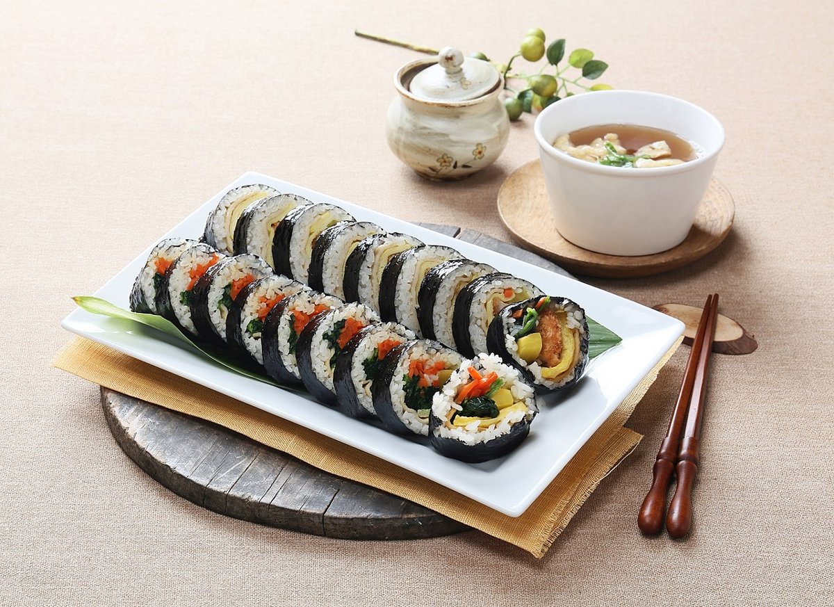 Fresh Korean kimbap rolls cut and arranged on a plate